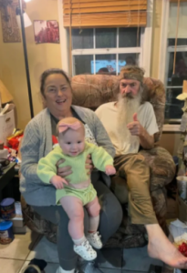 Kay and Phil Robertson pictured with a baby, dated May 2025 | Source: instagram/legitsadierob